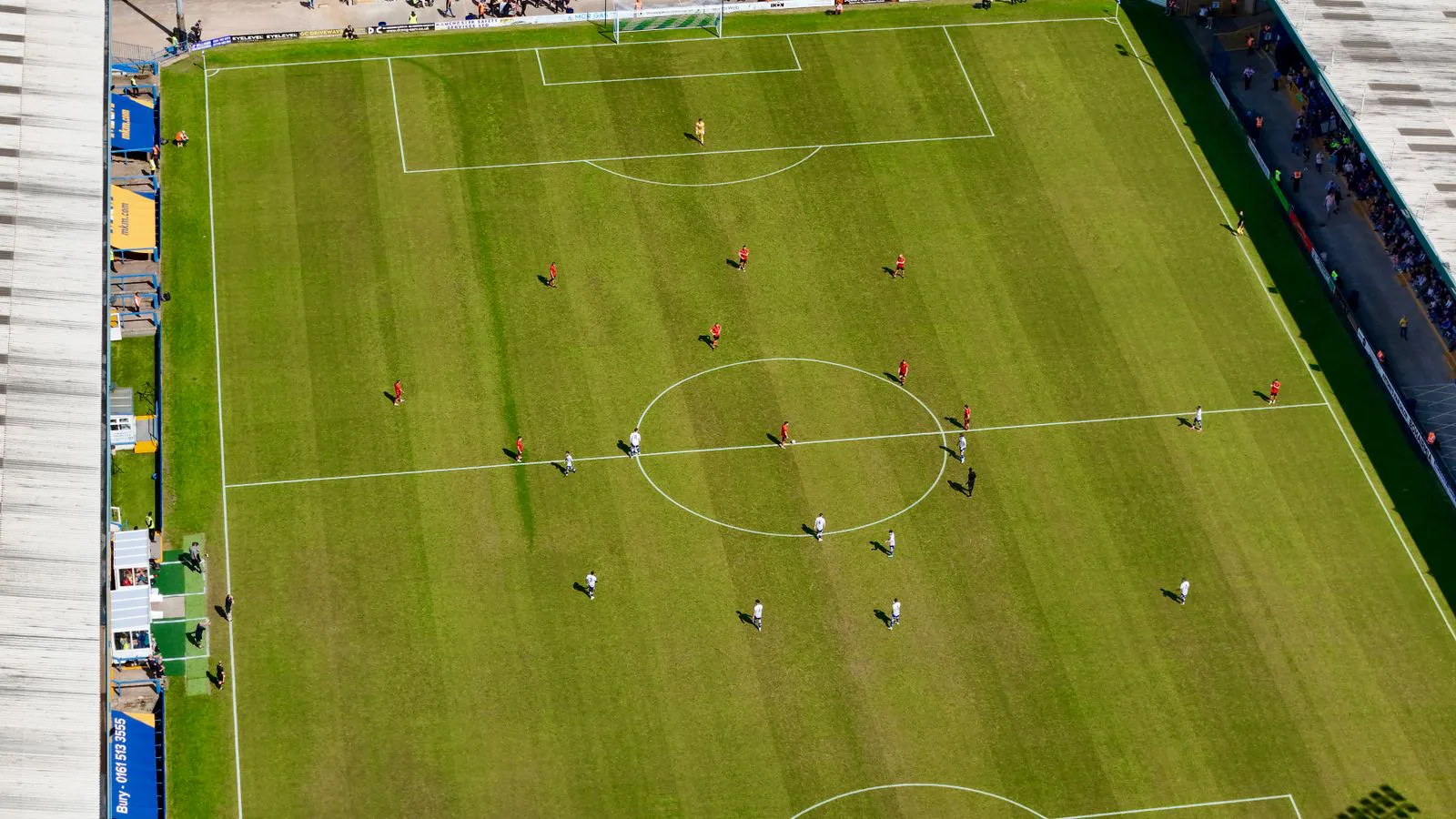 A football pitch and match seen from above.
