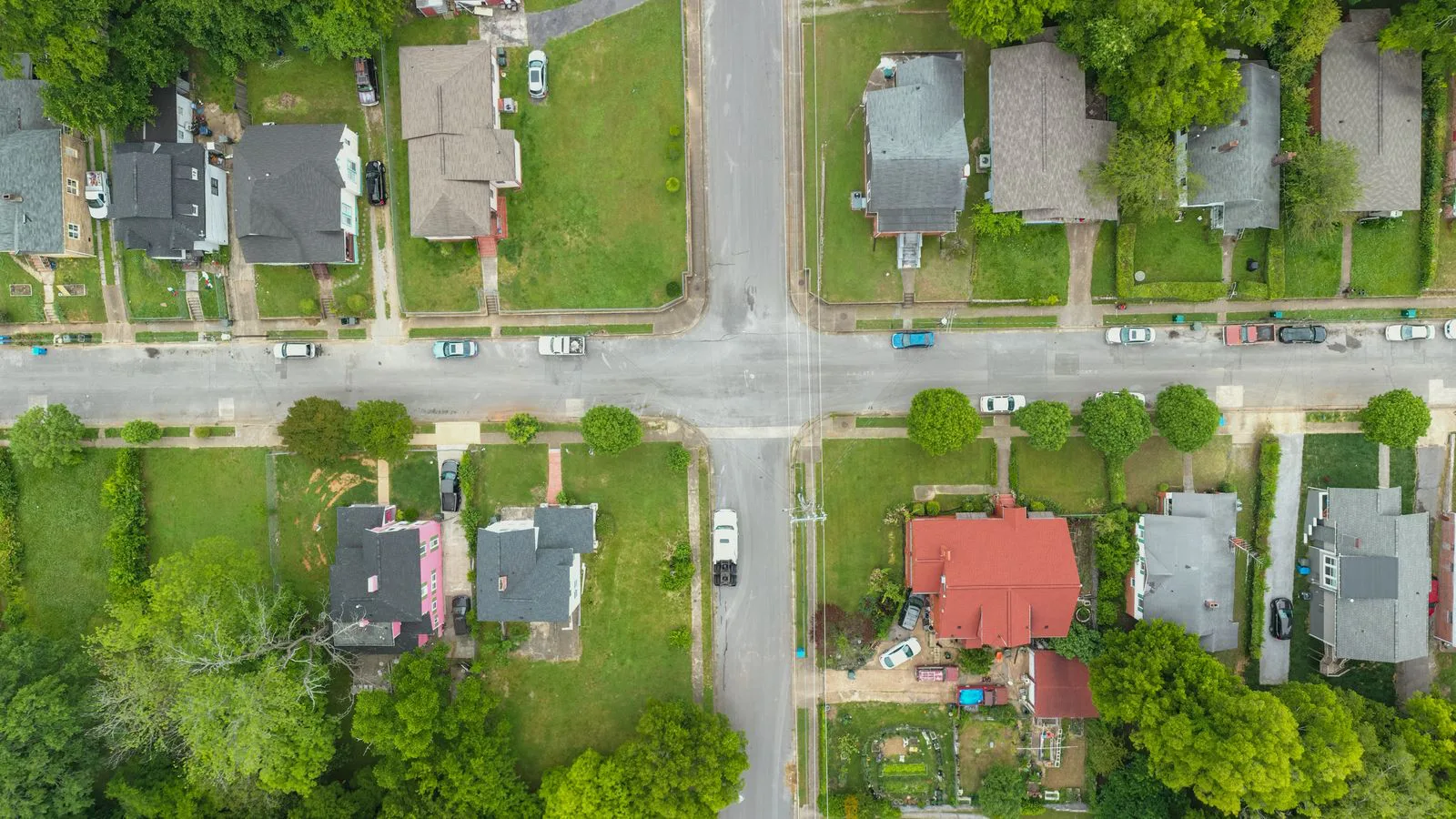 An aerial view of a suburban neighbourhood of detached houses.