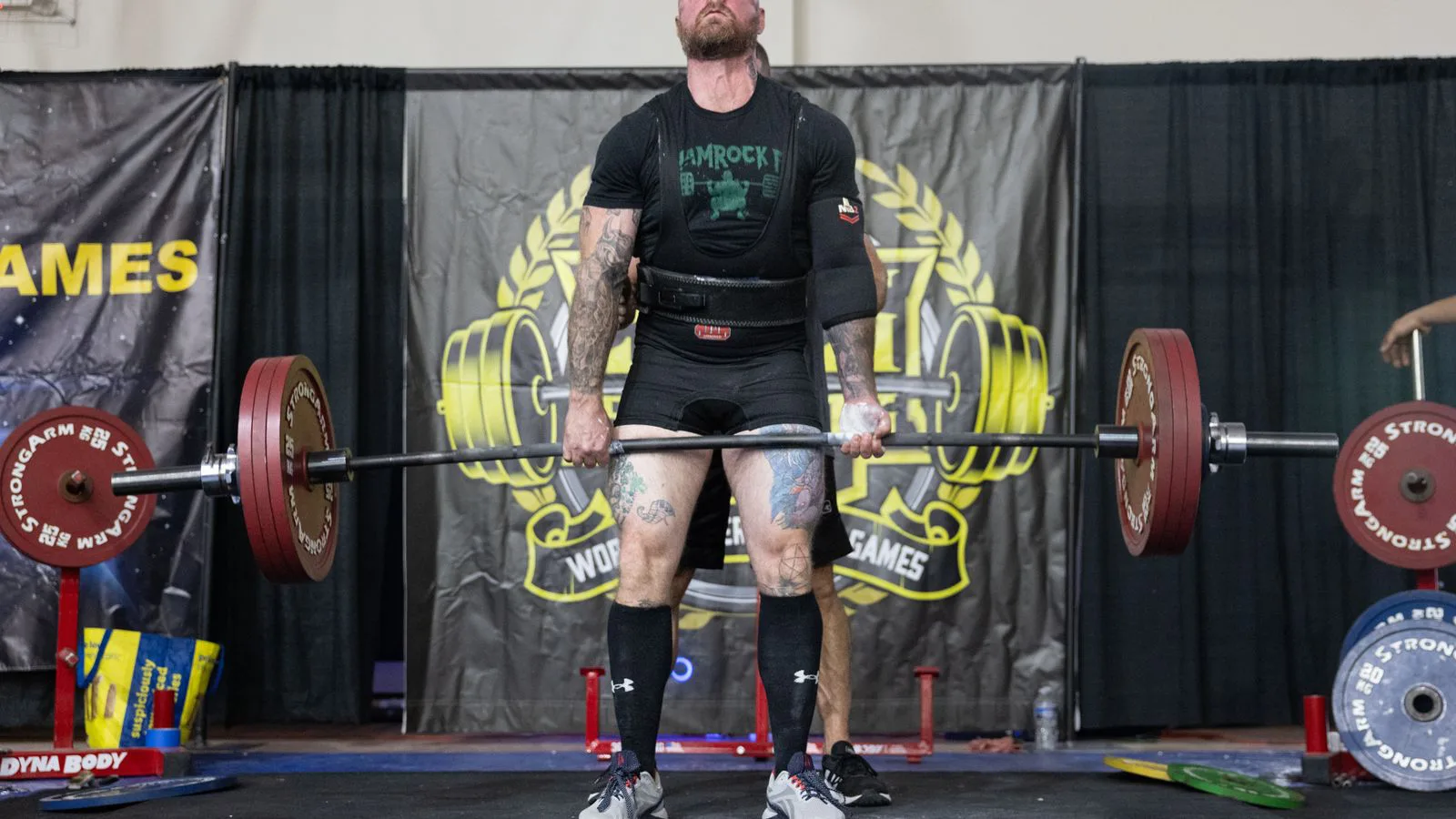 A lifter completing a deadlift at a competition.