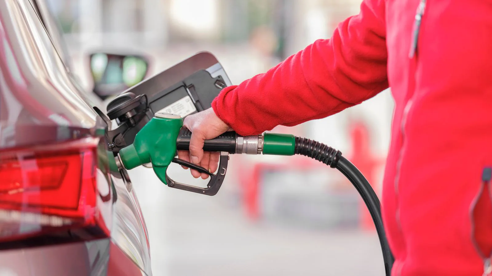 A car being refuelled at a filling station.