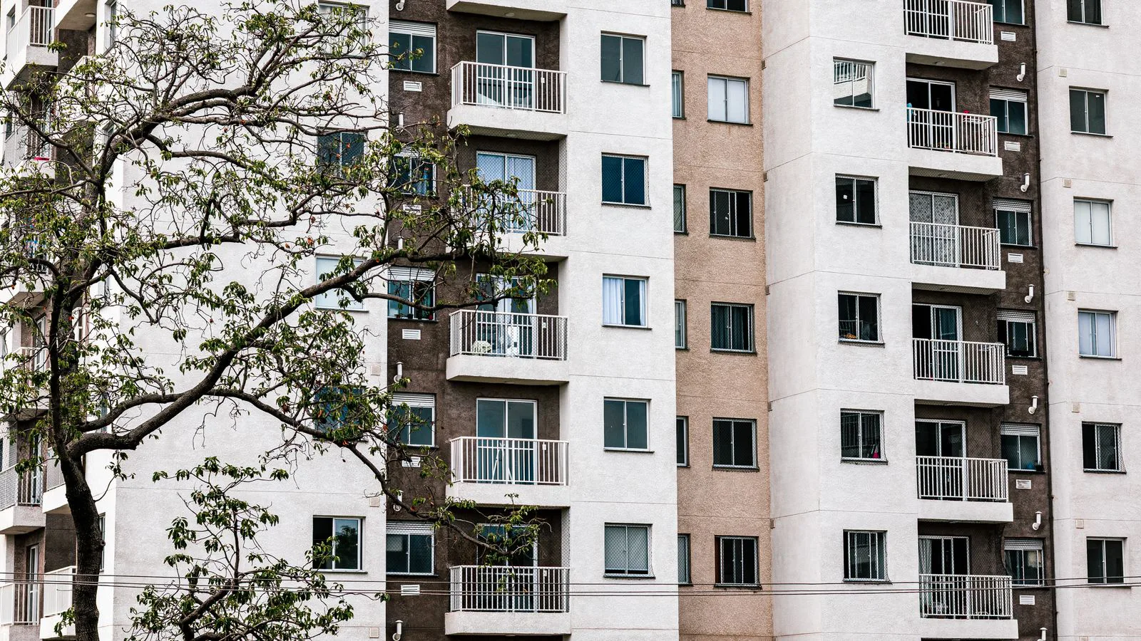 The facade of a modern apartment block with balconies.